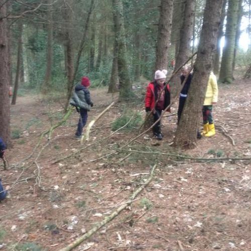 Stone Age Forest School - building shelter, hunting mammoths, starting fires, sharing a meal and cave painting.